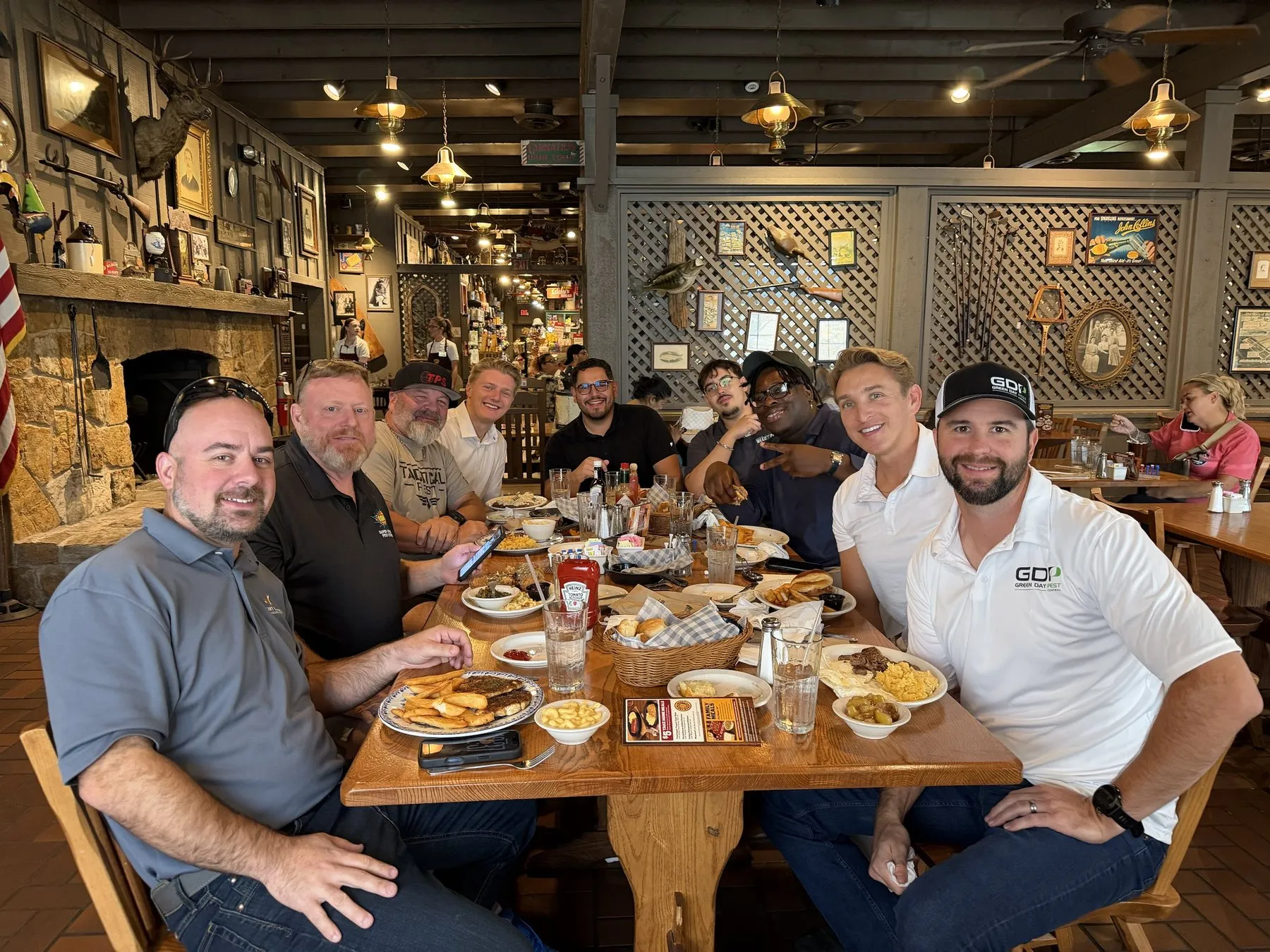 Members around a table at a restaurant during PestWorld week