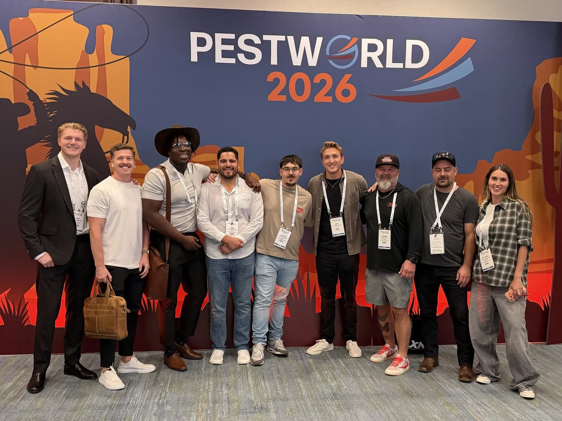 Dan Leibrandt, Jake Sheldon and the PCM group in front of the PestWorld 2026 sign