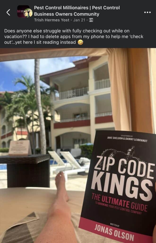 Reader holding Zip Code Kings pest control marketing book