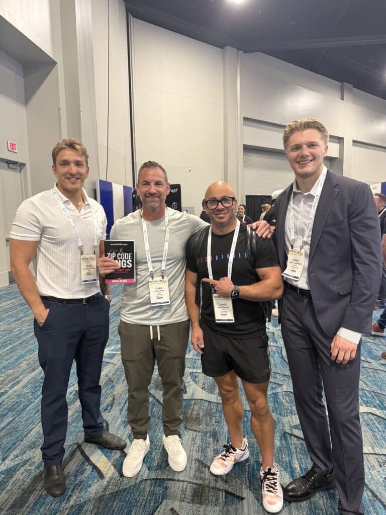 Pest control company owners with Zip Code Kings book near the meeting rooms at PestWorld 2025